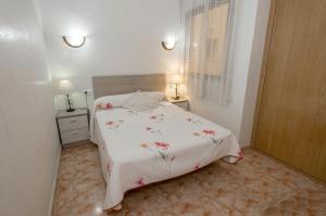 Postel nebo postele na pokoji v ubytování Apartamentos Turísticos Fresno + 78 fotografií