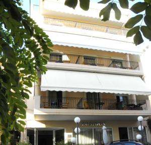 a building with balconies on the side of it at Posidon Studios in Loutra Edipsou