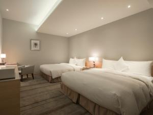 Postel nebo postele na pokoji v ubytování Hotel COZZI Zhongshan Kaohsiung + 27 fotografií