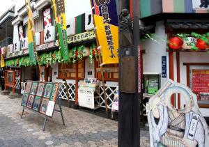 a building with signs in front of it at Hotel Trend Asakusa Annex in Tokyo