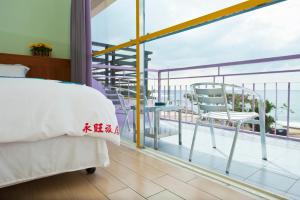 Vuode tai vuoteita majoituspaikassa 永旺旅店 Yong Wong Hostel