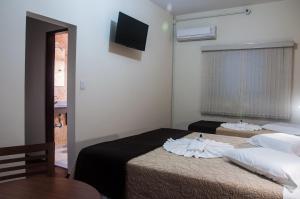 Postel nebo postele na pokoji v ubytování Hotel Rafeli