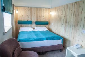 Postel nebo postele na pokoji v ubytování Complex Hotelier COTA O MIE