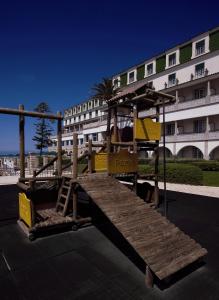 a playground in front of a large building at Vila Gale Ericeira in Ericeira