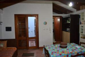 a living room with a table and a couch at Appartamenti Belvedere in SantʼAntìoco