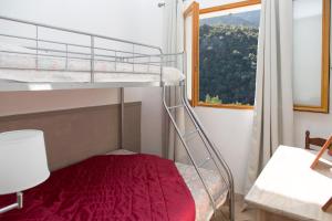Krevet ili kreveti na kat u jedinici u objektu Appartements A Merendella