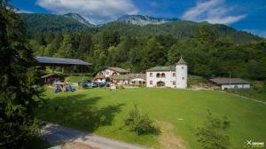 an aerial view of a building on a green field at Agriturismo Randis in Piano dʼArta