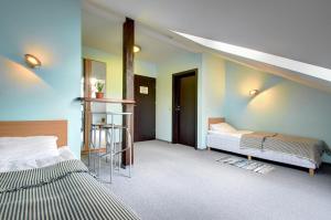 Postel nebo postele na pokoji v ubytování Aerohotel