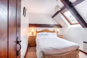 a bedroom with a large bed in a attic at The Grove Cromer in Cromer