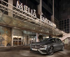 a car parked in front of a building at Melia Barcelona Sarriá in Barcelona