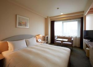 Postel nebo postele na pokoji v ubytování Kawagoe Prince Hotel + 30 fotografií