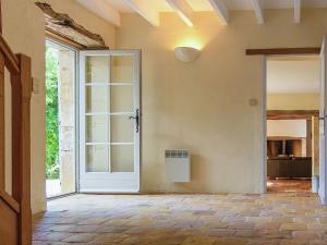 an empty room with a door and a window at Sprawling Mansion in Aquitaine with Swimming Pool in Campsegret