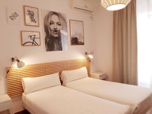Posteľ alebo postele v izbe v ubytovaní Las Atarazanas - Design Hostal
