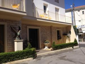 a building with a staircase leading to a balcony at Le Stanze del Pescatore in Bellaria-Igea Marina