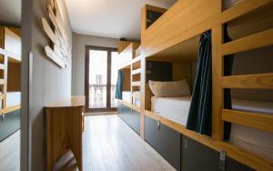 a room with bunk beds and a bed in it at Yeah Barcelona Hostel in Barcelona