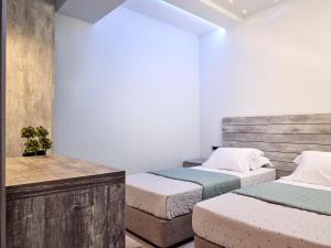 Postel nebo postele na pokoji v ubytování Savvas Luxury Suites