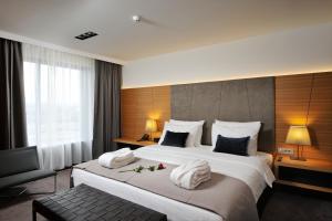 En eller flere senge i et værelse på Radisson Blu Plaza Hotel Ljubljana