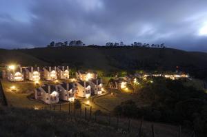an aerial view of a mansion at night at Plaza Inn Week Inn in Campos do Jordão