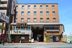 a building on the corner of a city street at Yamato Kashihara City Hotel in Kashihara