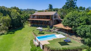 an aerial view of a house with a swimming pool at Pumula Lodge 4 Star B&B Knysna in Knysna