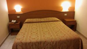Postel nebo postele na pokoji v ubytování Hotel Giardino