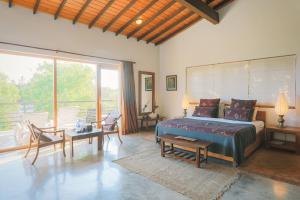 a bedroom with a bed and a large window at Highland Villa in Weligama +37 photos