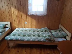 Posteľ alebo postele v izbe v ubytovaní Janowa Chata