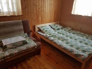 Posteľ alebo postele v izbe v ubytovaní Janowa Chata