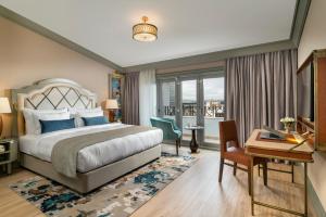 A bed or beds in a room at Millennium Istanbul Golden Horn