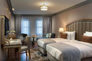 A bed or beds in a room at Millennium Istanbul Golden Horn