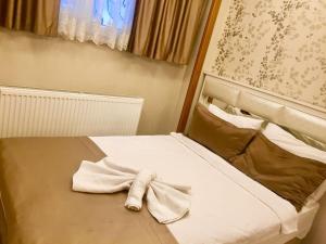 Postel nebo postele na pokoji v ubytování ARINÇ HOTEL