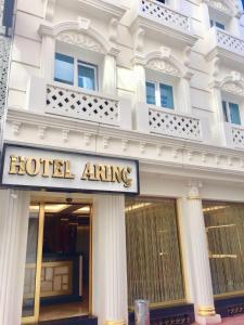 a hotel opening sign in front of a building at ARINÇ HOTEL in Istanbul