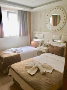 Postel nebo postele na pokoji v ubytování ARINÇ HOTEL