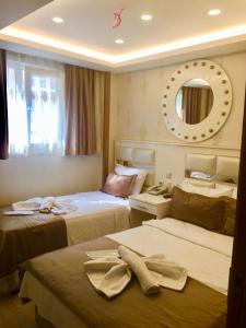Postel nebo postele na pokoji v ubytování ARINÇ HOTEL + 37 fotografií