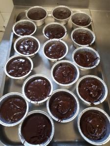 a tray of chocolate muffins in muffin cups at Agriturismo Barba Gust in Cesana Torinese