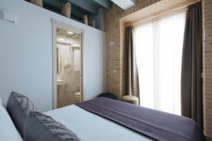 Postel nebo postele na pokoji v ubytování Hommyhome Casa Assle