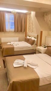 Postel nebo postele na pokoji v ubytování ARINÇ HOTEL