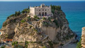 a castle on top of a mountain on the ocean at Villa Giusi in Tropea