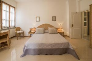 Postel nebo postele na pokoji v ubytování Hotel Bellonda