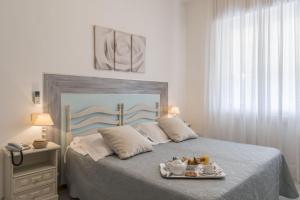 Postel nebo postele na pokoji v ubytování Hotel Bellonda