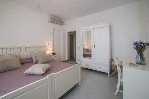 Postel nebo postele na pokoji v ubytování Hotel Bellonda