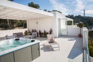 a hot tub on the patio of a house at Residence Porto Grande in Leuca