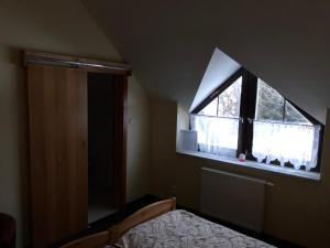 Postel nebo postele na pokoji v ubytování Penzion Tetřívek