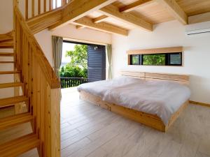 Postel nebo postele na pokoji v ubytování Villa SACHIIBARU 浜辺の茶屋 の 宿
