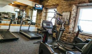 a gym with several exercise bikes in a room at Newport Bay Club and Hotel in Newport