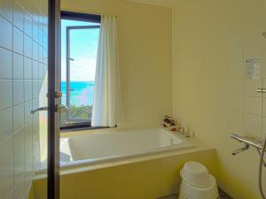 Koupelna v ubytování Villa SACHIIBARU 浜辺の茶屋 の 宿