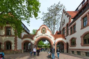a group of people walking in front of a building at Best Western Hotel Leipzig City Centre in Leipzig