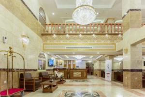 a lobby of a synagogue with a chandelier at Hotel Ritaj Alsahel in Yanbu