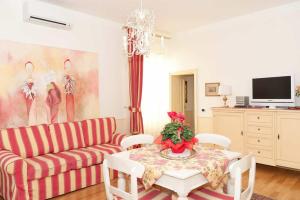 a living room with a couch and a table at Apartments In Pistoia in Pistoia