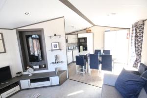 a living room with a couch and a dining room at Jackson Lodge in Perth